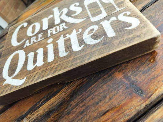 Handmade upcycled wooden sign with "Corks are for Quitters" text