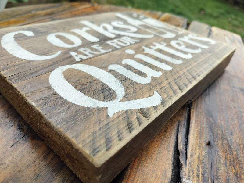 Handmade upcycled wooden sign with "Corks are for Quitters" text