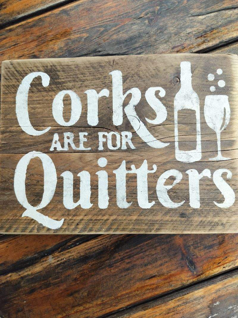 Handmade upcycled wooden sign with "Corks are for Quitters" text