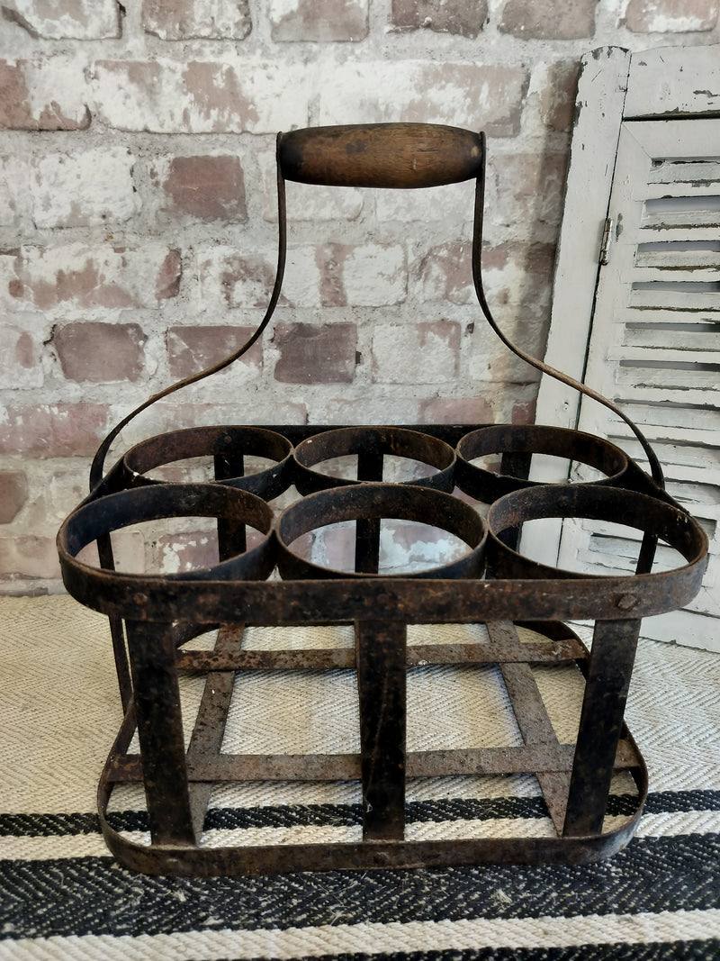 Vintage French metal bottle carrier with wooden handle, 6-bottle holder, rustic aged patina, farmhouse decor.