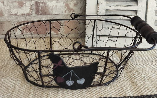 Vintage French rustic black wire egg basket with wooden handle and decorative hen detail with hearts