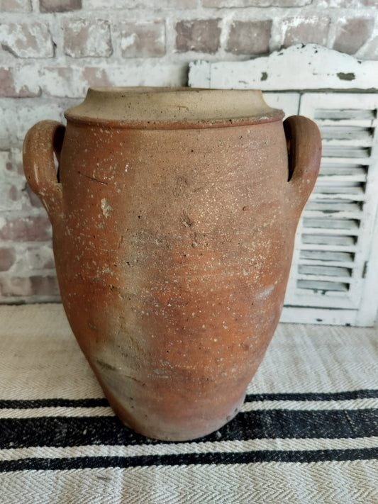 Antique French terracotta two-handled rustic storage jar with aged patina and earthy tones