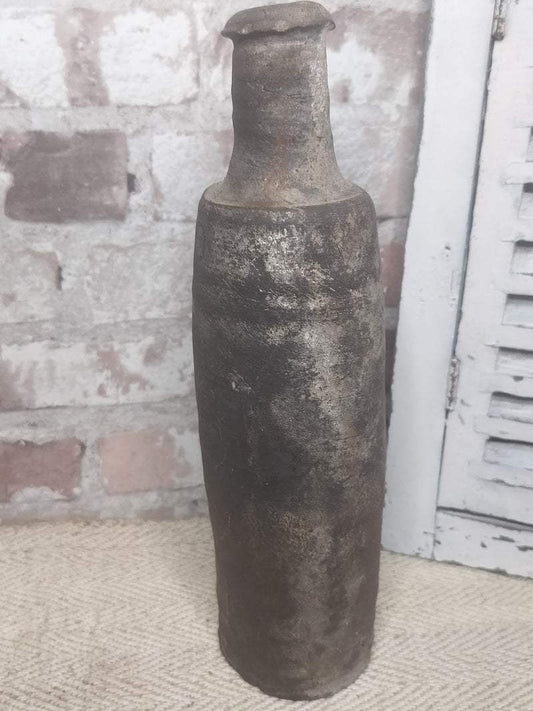 Antique 19th century French stoneware bottle with rustic patina and weathered surface