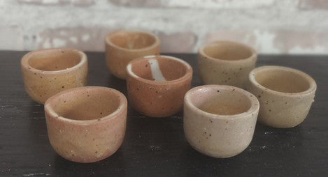 Set of French vintage stoneware escargot pots in natural terracotta and earthen tones with rustic glaze variations