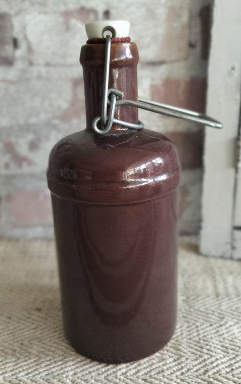 Vintage French stoneware brown bottle with swing-top ceramic stopper and glossy glaze