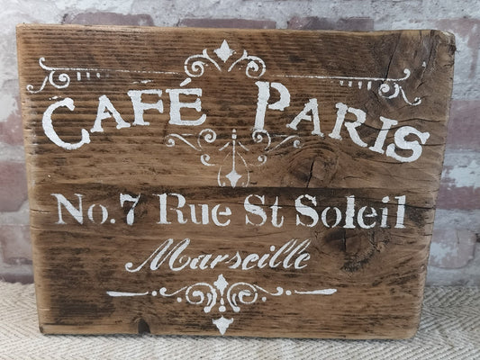 Upcycled handmade wooden cafe sign with white lettering on natural rustic wood background